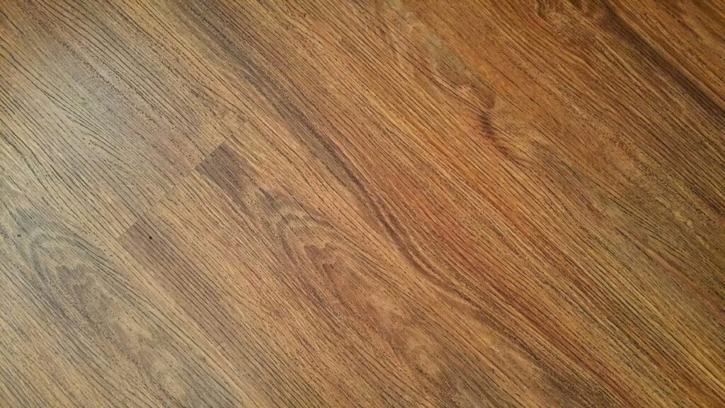 Detailed image of rustic wooden flooring with visible wood grain texture.